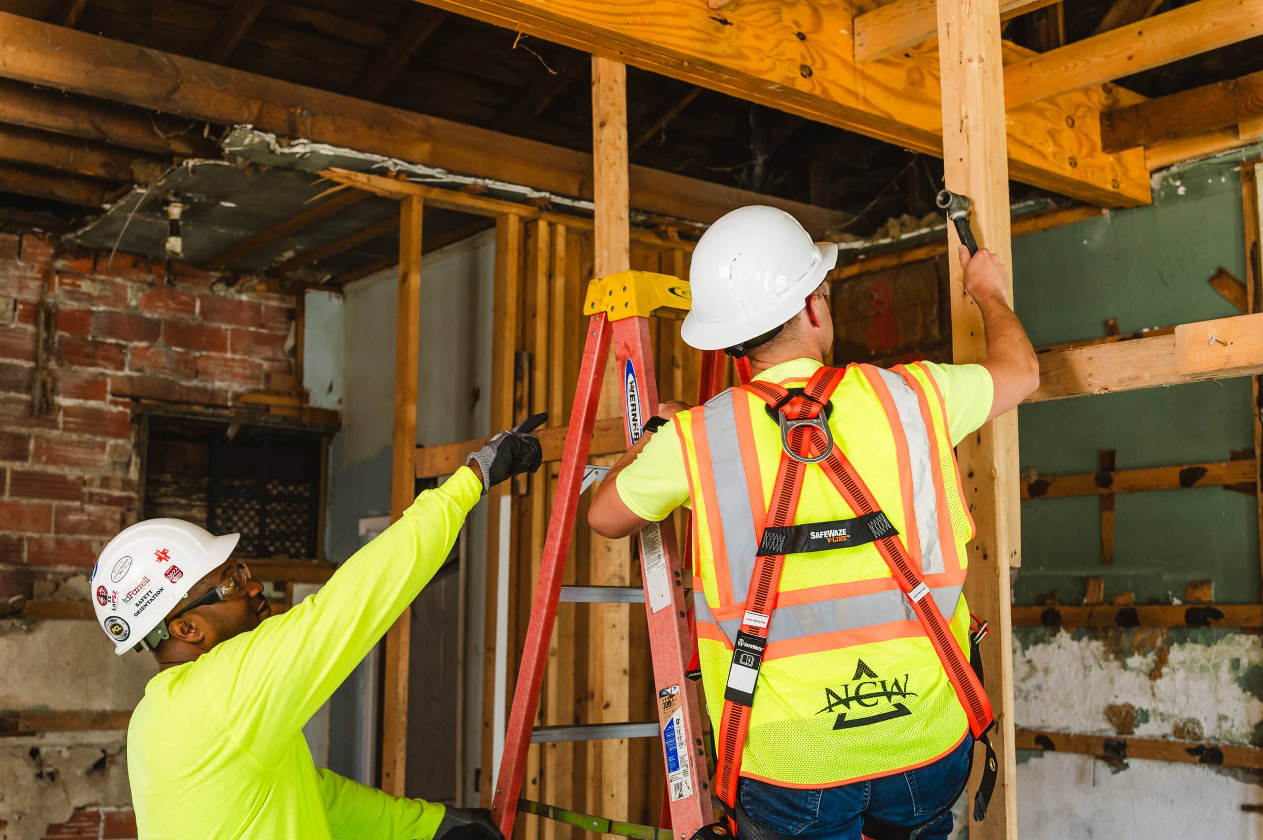 An NCW apprentice is guided by his mentor while on the job