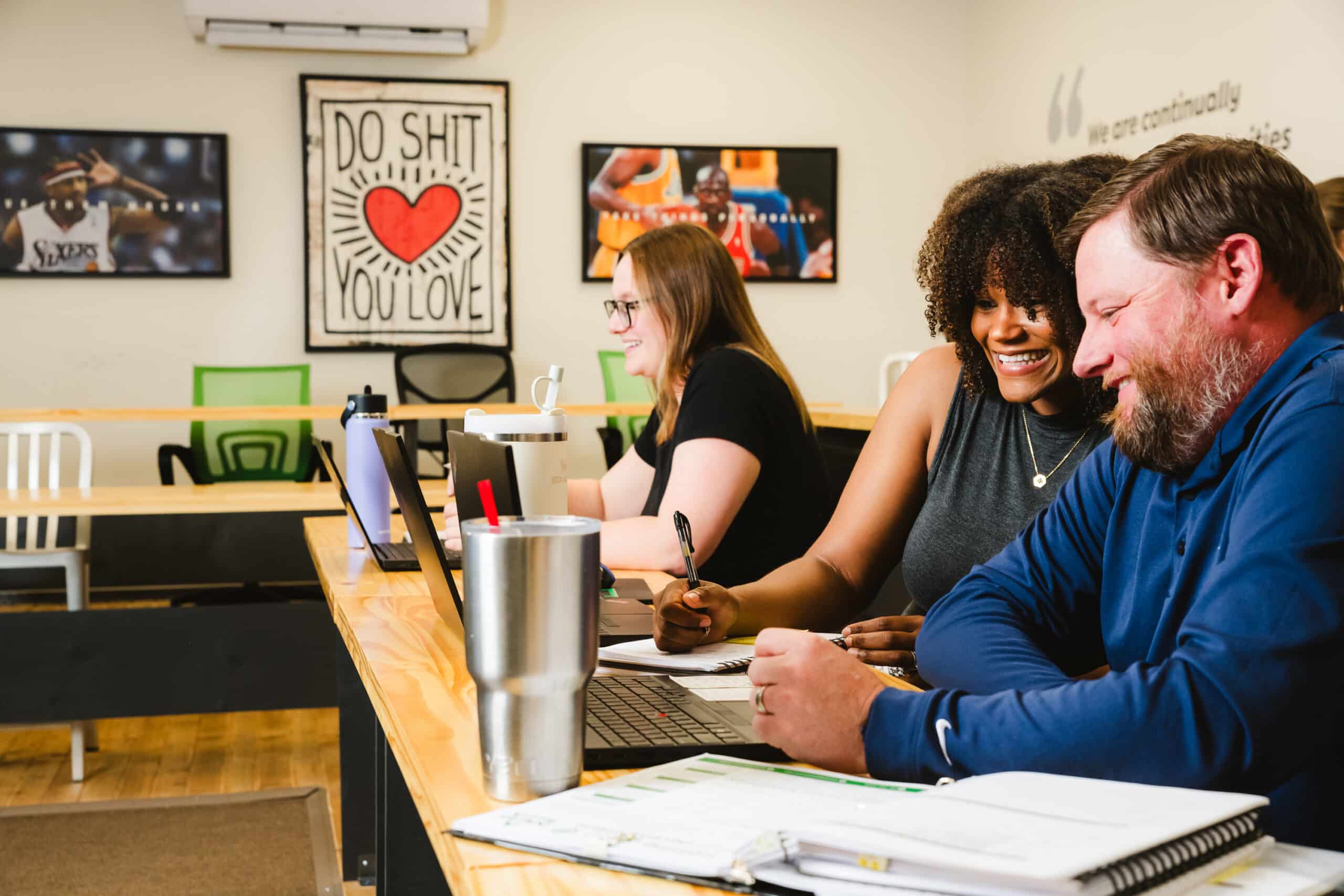 Recruiters and business development representatives work on placing candidates for a client's job site