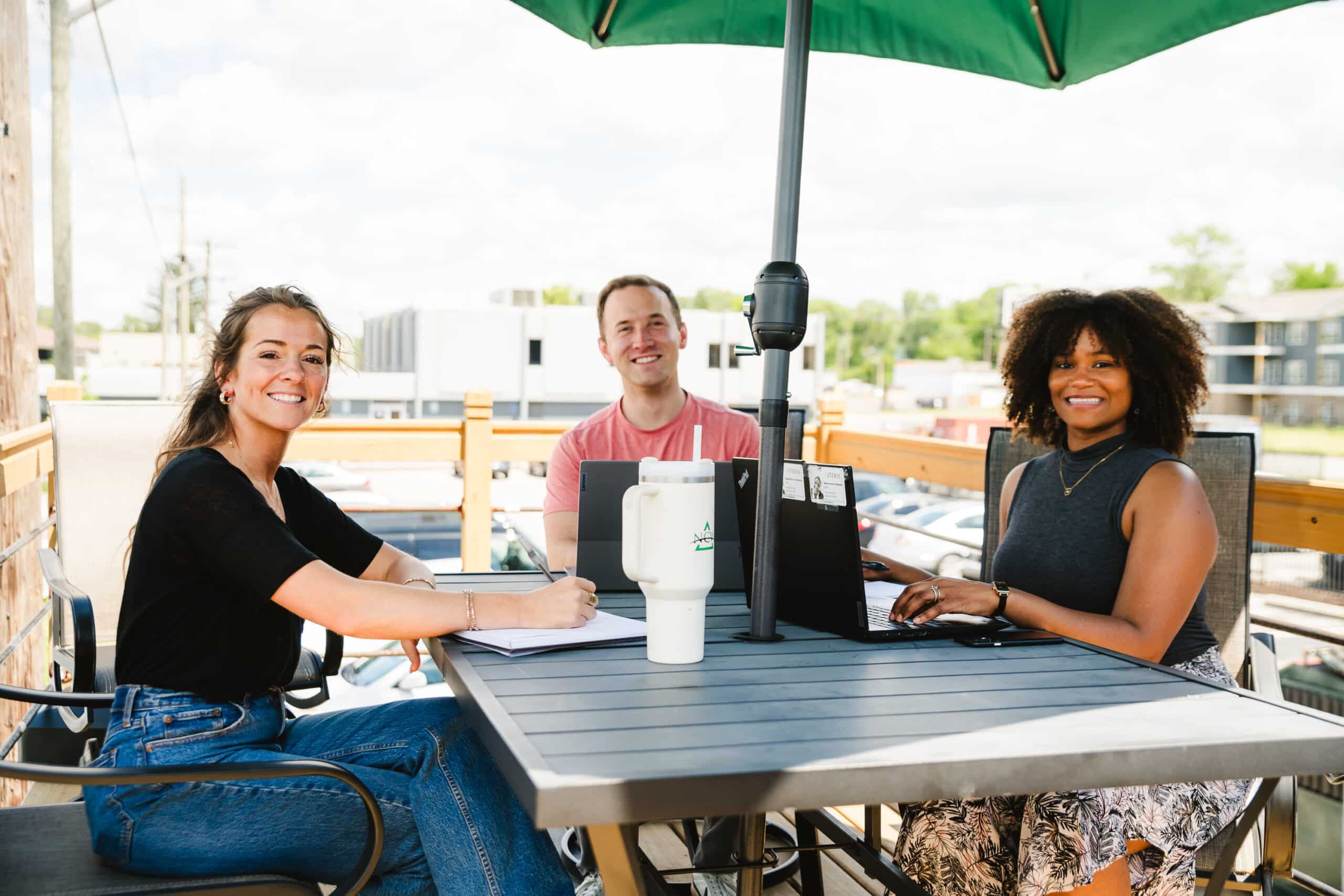 NCW construction staffing agency employees smile mid-meeting