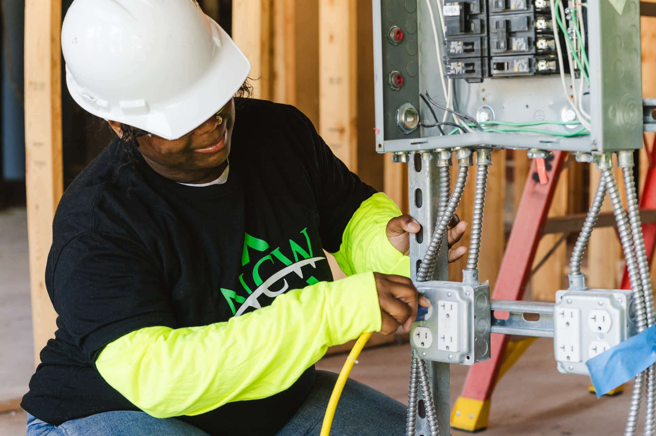 Electrical engineer testing electrical equipment on a job site