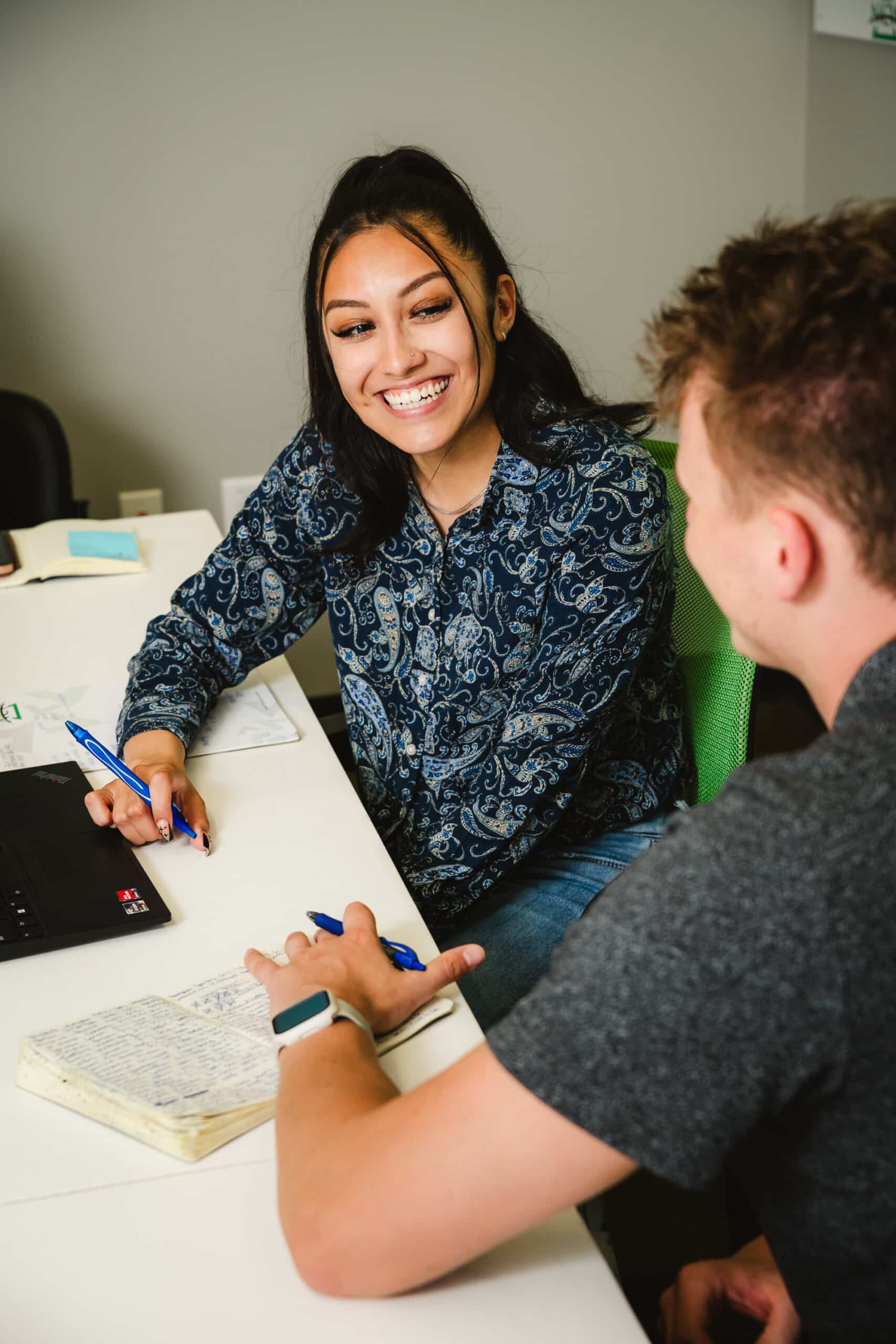 A recruiter interviews a candidate for a job in warehousing