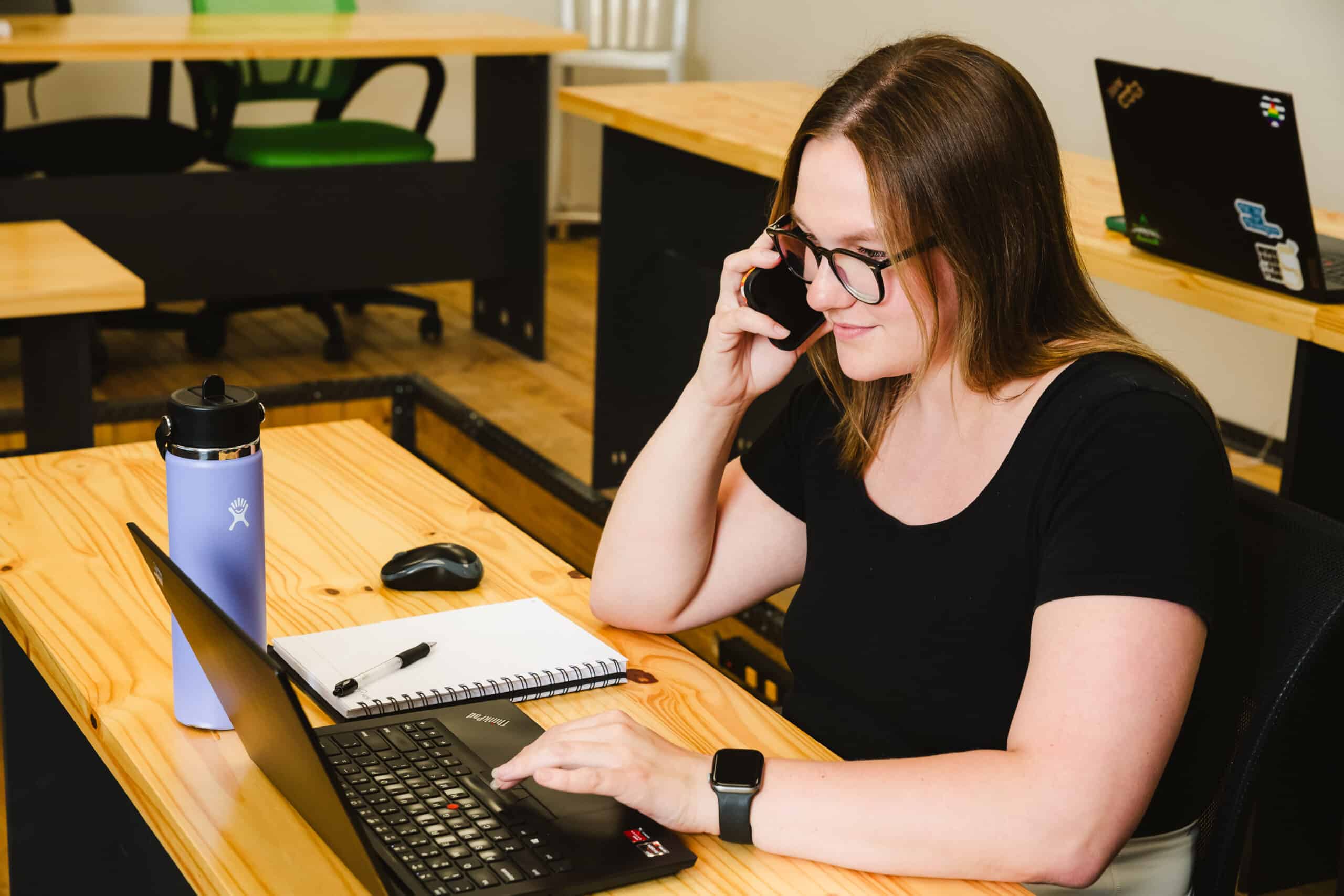 A business development representative works with a client to help them build their warehouse staff