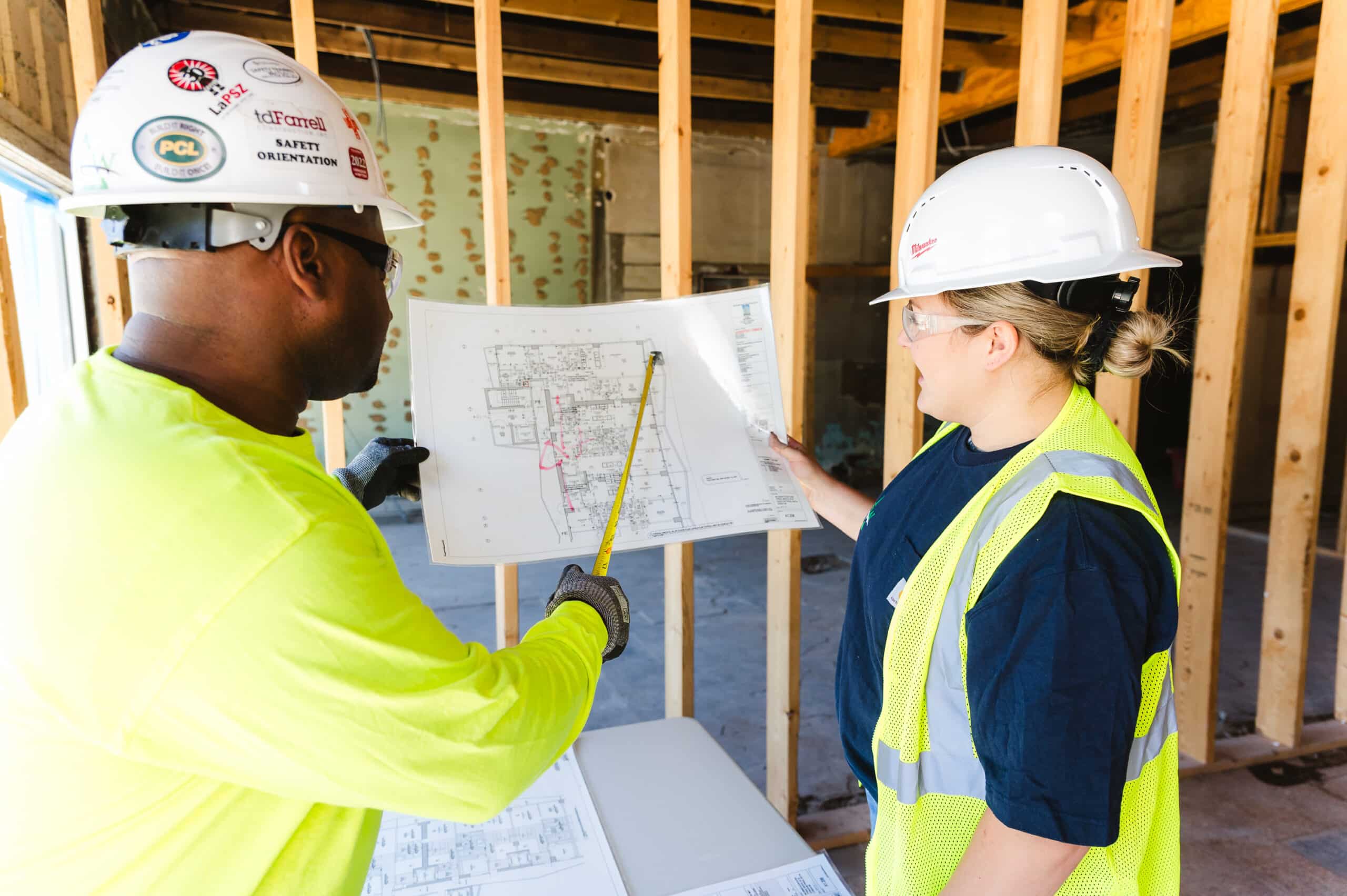 A construction engineer reviews blueprints 