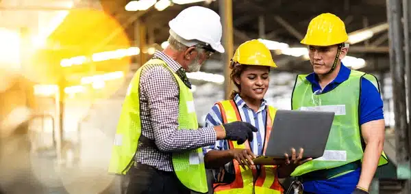 A group of MEP engineers collaborate on a jobsite